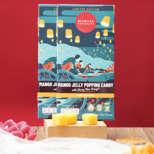 Two boxes of Bhamaya Mango Jelly Popping Candy on a stand with a red background