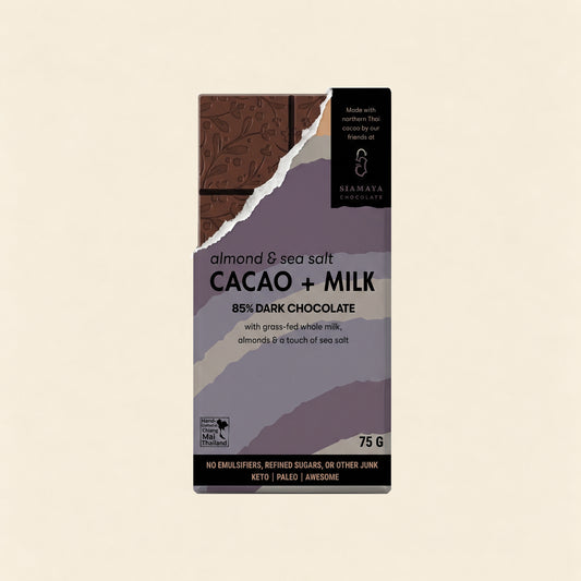 85% Simply Cacao Chocolate Milk, Almonds & Sea Salt, front packaging on a warm beige background.