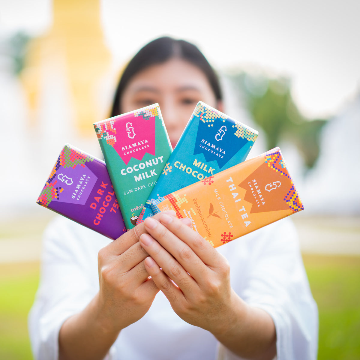 Four Siamaya bars in vivid color-block wrappers