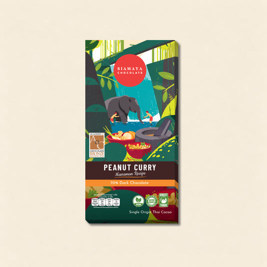 Thai Peanut Curry 70% Dark Chocolate, front packaging on a warm beige background.