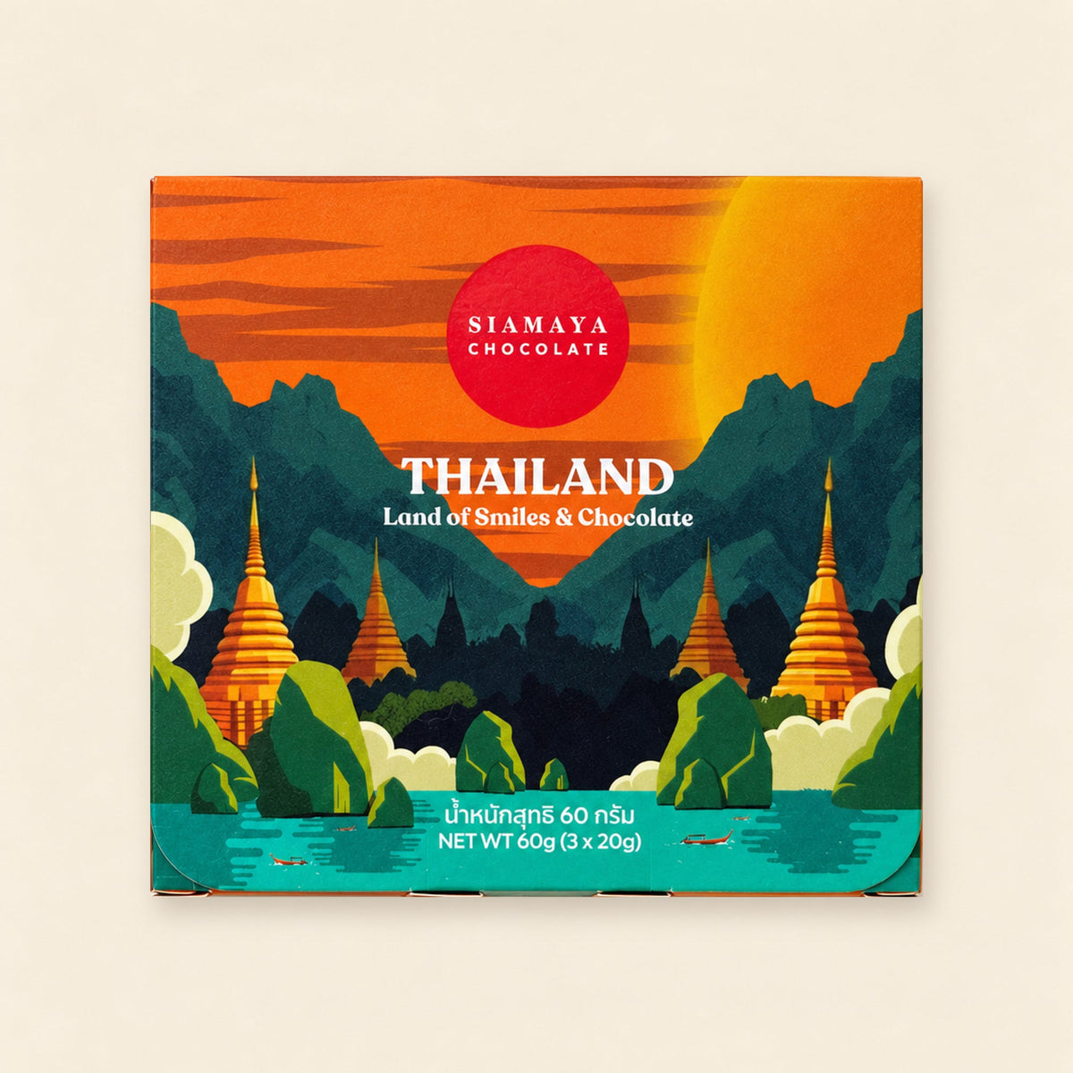 Thailand gift set closed packaging, front view on a warm sand background.