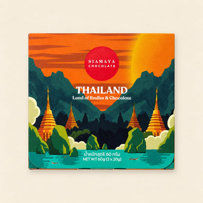 Thailand gift set closed packaging, front view on a warm sand background.